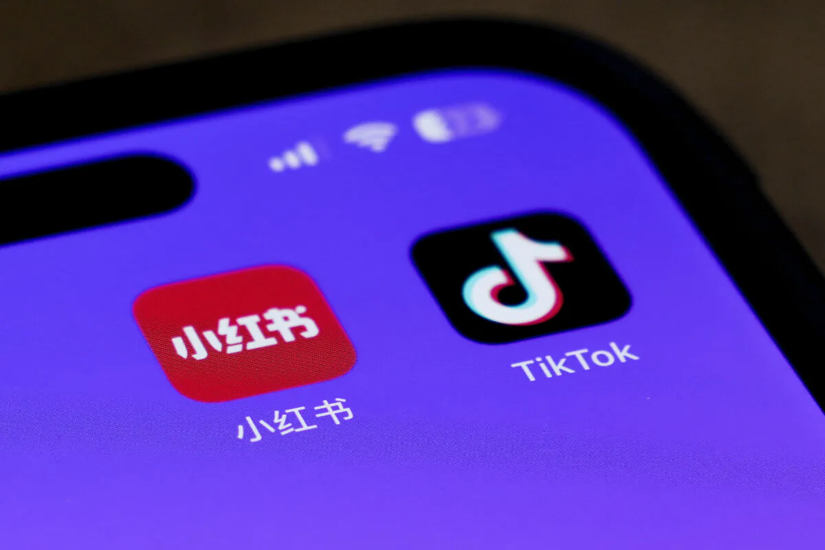 Icons for the smartphone apps Xiaohongshu and TikTok are seen on a smartphone screen in Beijing, on Jan. 14, 2025. (AP Photo/Andy Wong)