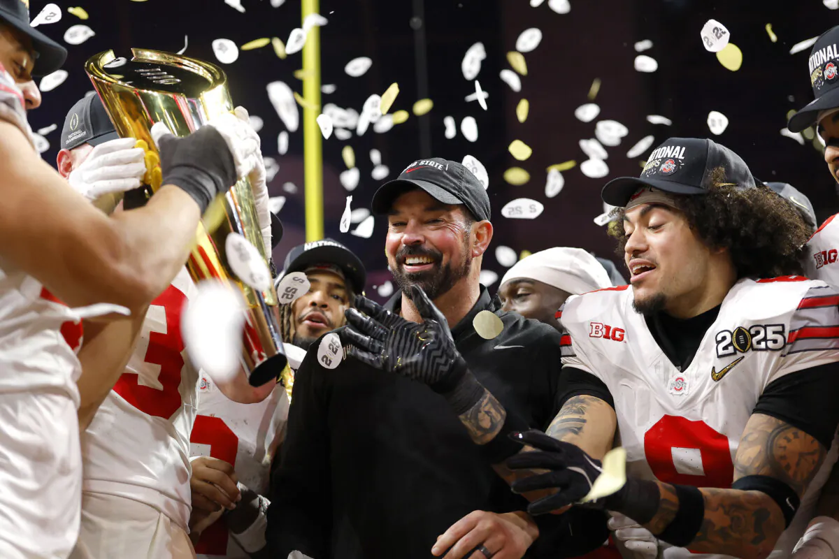 Ohio State Buckeyes head coach Ryan Day celebrates with the team after beating Notre Dame in the 2025 CFP National Championship at Mercedes-Benz Stadium on Jan. 20 in Atlanta. (Todd Kirkland/Getty Images)
