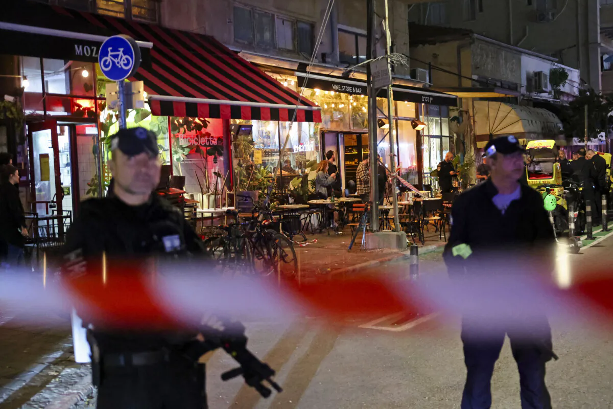 Members of Israeli security forces stand guard at the site of a stabbing attack in Tel Aviv where four people were injured and the assailant killed on Jan. 21, 2025. (Jack Guez/AFP via Getty Images)
