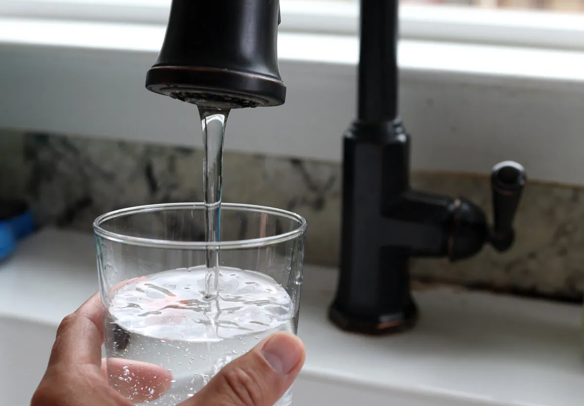 Water from a tap fills a glass in San Anselmo, California, on July 6, 2023. (Justin Sullivan/Getty Images)