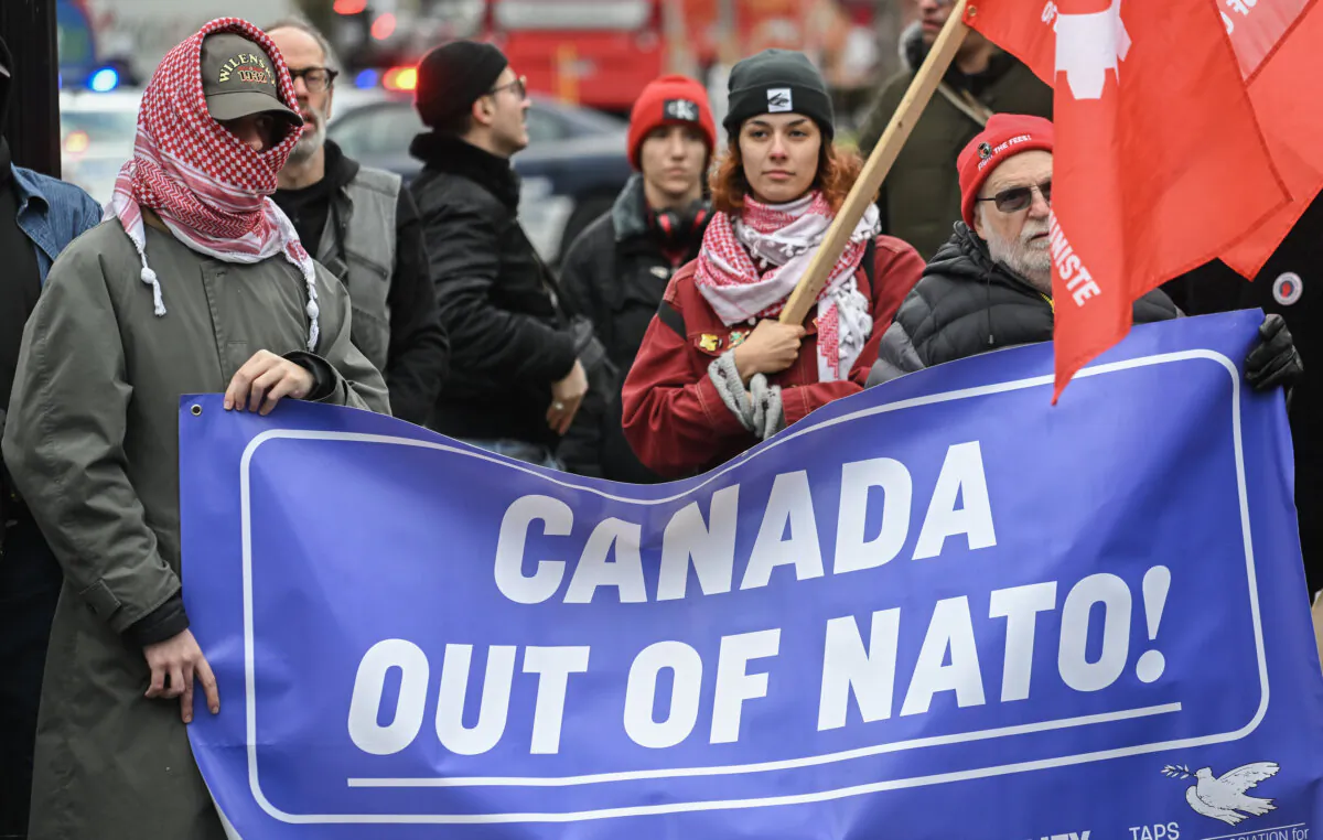 People take part in a protest against NATO in Montreal, on Nov. 23, 2024. (The Canadian Press/Graham Hughes) 