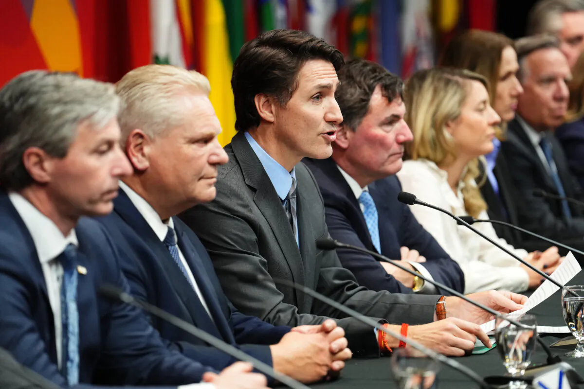 Prime Minister Justin Trudeau (3rd L) speaks at a press conference concluding a first ministers meeting, in Ottawa, on Jan. 15, 2025. (The Canadian Press/Sean Kilpatrick)