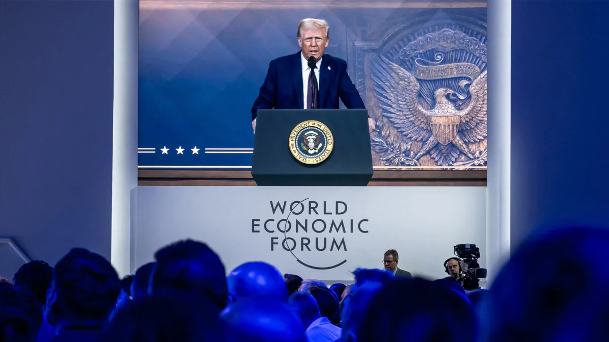 U.S. President Donald Trump is shown on a giant screen during his address by video conference at the World Economic Forum (WEF) annual meeting in Davos, Switzerland, on Jan. 23, 2025. (Fabrice Coffrini/AFP via Getty Images)