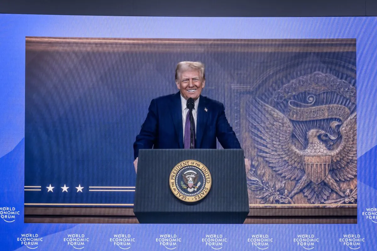 President Donald Trump is seen on a large screen during his address by video conference at the World Economic Forum (WEF) annual meeting in Davos, Switzerland, on Jan. 23, 2025. (Fabrice Coffrini / AFP)