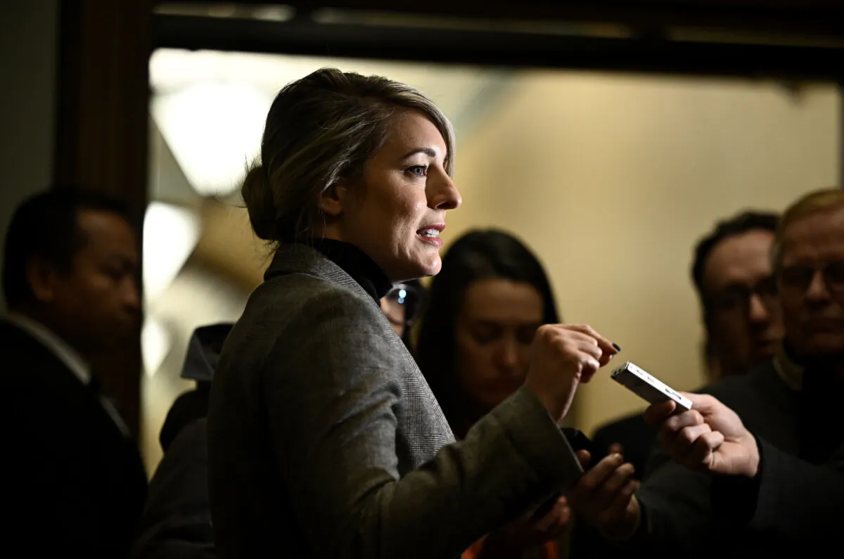 Minister of Foreign Affairs Melanie Joly answers questions from journalists before a meeting of the Liberal caucus in West Block on Parliament Hill in Ottawa, on Jan. 23, 2025. (The Canadian Press/Justin Tang)