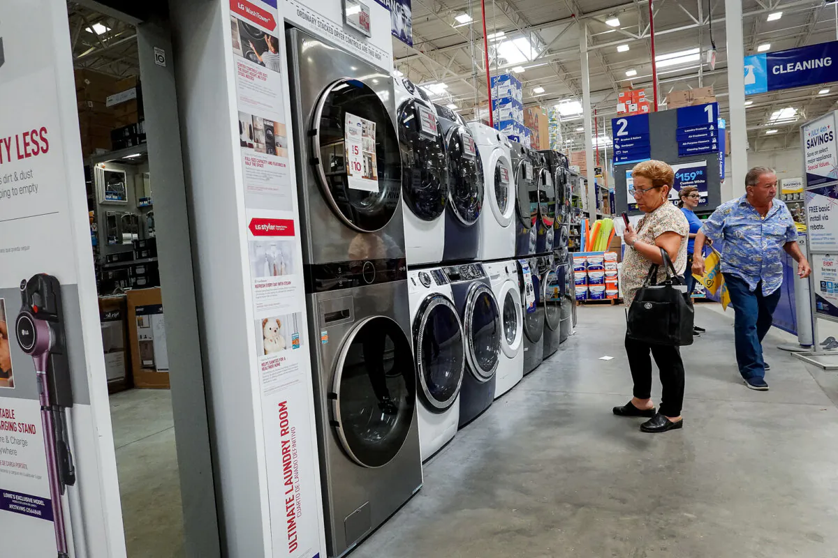 A customer looks at washers and dryers on display at a Lowe's home improvement store in Miami on June 27, 2022. (Joe Raedle/Getty Images)