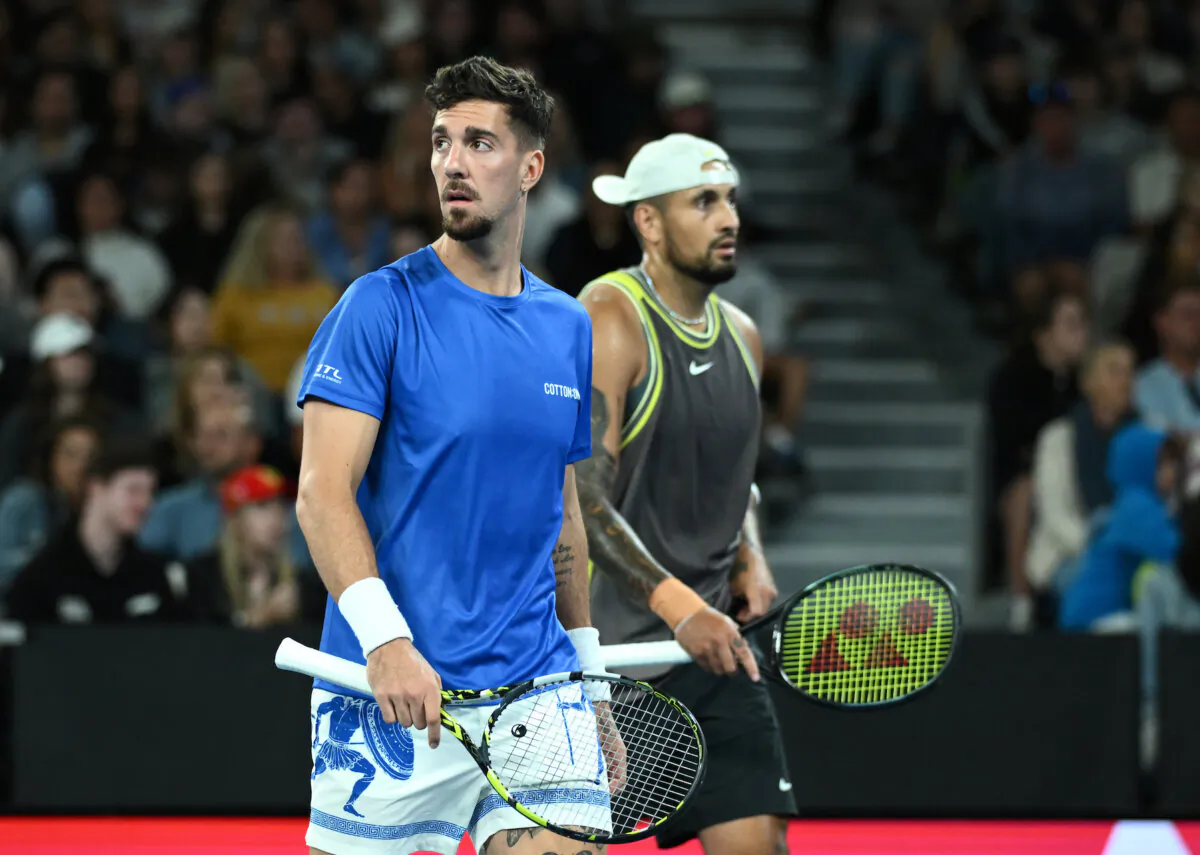 Thanasi Kokkinakis and Nick Kyrgios of Australia during their round 1 Doubles match against James Duckworth and Aleksandar Vukic of Australia during the 2025 Australian Open at Melbourne Park in Melbourne, Jan. 16, 2025. (AAP Image/Joel Carrett)