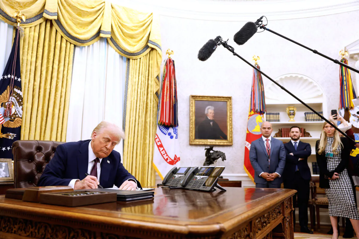 President Donald Trump signs a series of executive orders in the Oval Office of the White House on Jan. 23, 2025. (Anna Moneymaker/Getty Images)