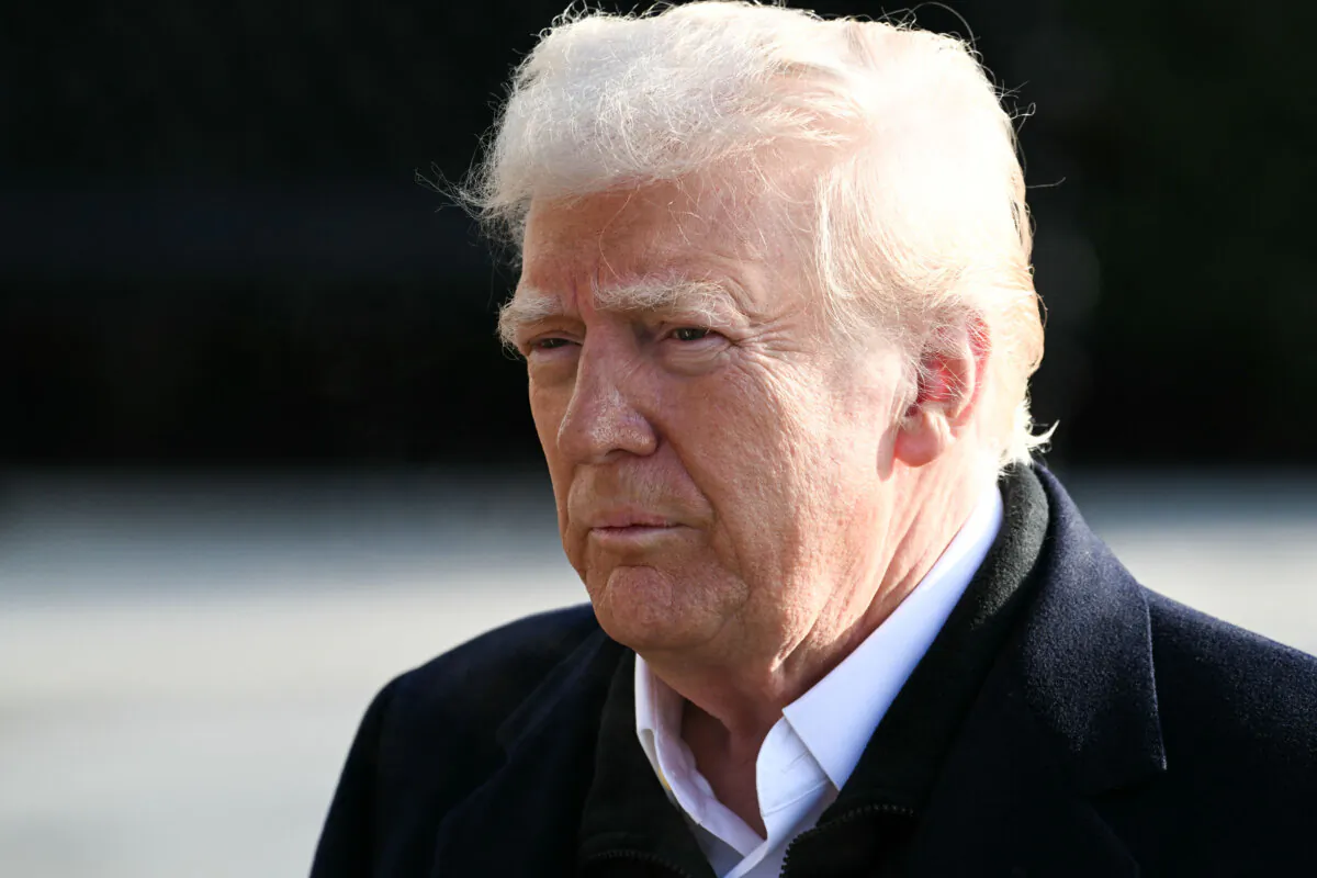 President Donald Trump speaks to the press before boarding Marine One on the South Lawn of the White House on Jan. 24, 2025. (Pedro Ugarte/AFP via Getty Images)