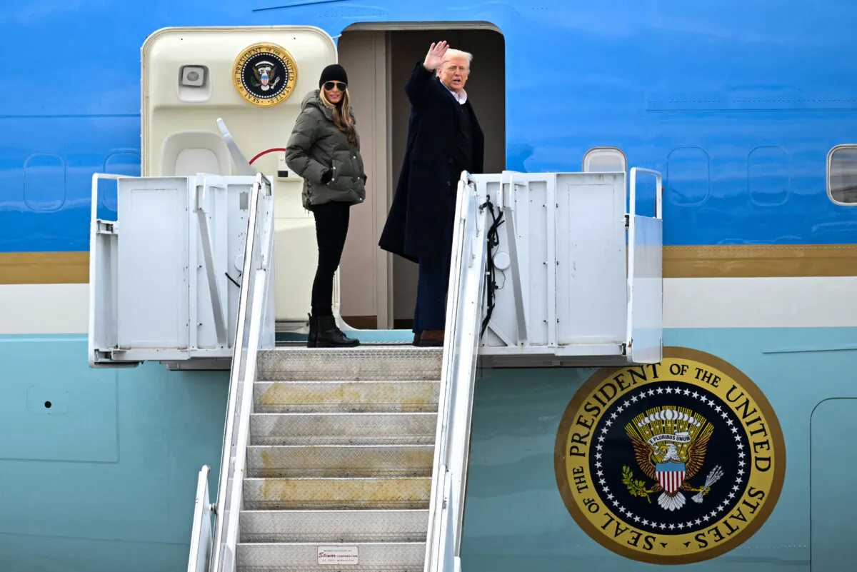 President Donald Trump and First Lady Melania Trump board Air Force One at Asheville Regional Airport in Fletcher, N.C., on Jan. 24, 2025. (Mandel Ngan/AFP via Getty Images)