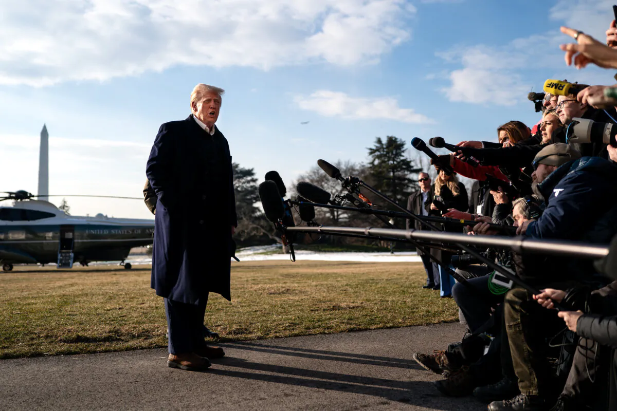President Donald Trump speaks to members of the press as he and First Lady Melania Trump prepare to depart the White House aboard Marine One in Washington on Jan. 24, 2025. (Kent Nishimura/Getty Images)