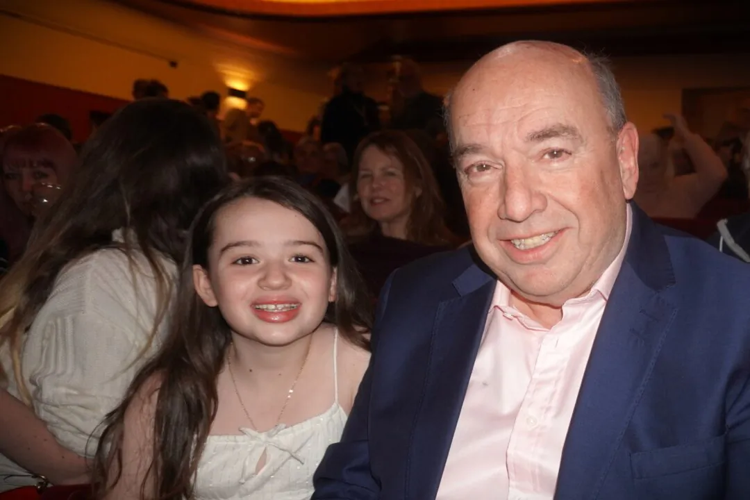 Bryce Glover and his daughter enjoyed Shen Yun at the New Theatre in Oxford, UK, on Jan. 24, 2025. (Mary Man/The Epoch Times)