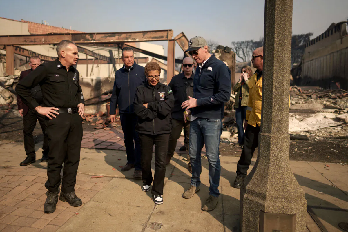 California Gov. Gavin Newsom (R) and Los Angeles Mayor Karen Bass tour the downtown business district of Pacific Palisades as the Palisades Fire continues to burn in Los Angeles on Jan. 8, 2025. (Eric Thayer/Getty Images)