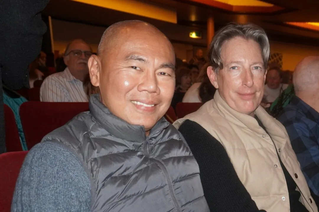 Gary Moody (R) attended Shen Yun Performing Arts with a friend at the New Theatre in Oxford, UK, on Jan. 25, 2025. (Mary Man/The Epoch Times)