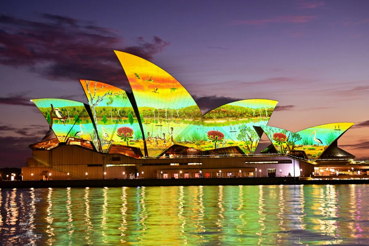 The sails of the Sydney Opera House are illuminated by a projection of artwork by Wiradjuri man and renowned artist James P Simon “River Life” on Australia Day in Sydney, Australia, on Jan. 26, 2025. (Izhar Khan/Getty Images)