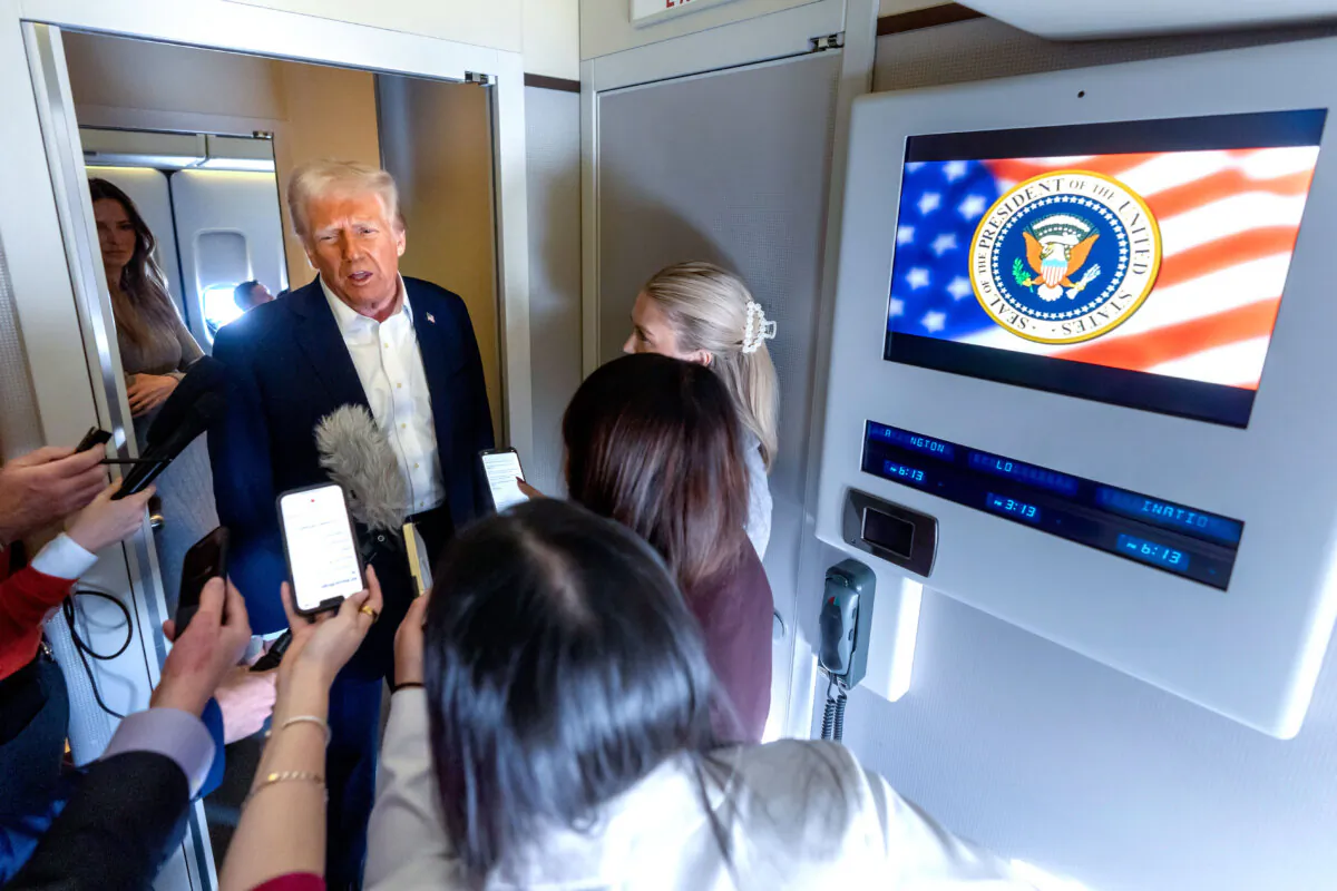 President Donald Trump speaks to reporters aboard Air Force One as he travels from Las Vegas to Miami on Jan. 25, 2025. (Mark Schiefelbein/AP Photo)