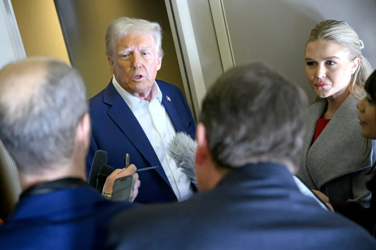 President Donald Trump speaks with the press, alongside White House Press Secretary Karoline Leavitt (R), on board Air Force One after departing Las Vegas, en route to Miami on Jan. 25, 2025. (Mandel Ngan/AFP via Getty Images)