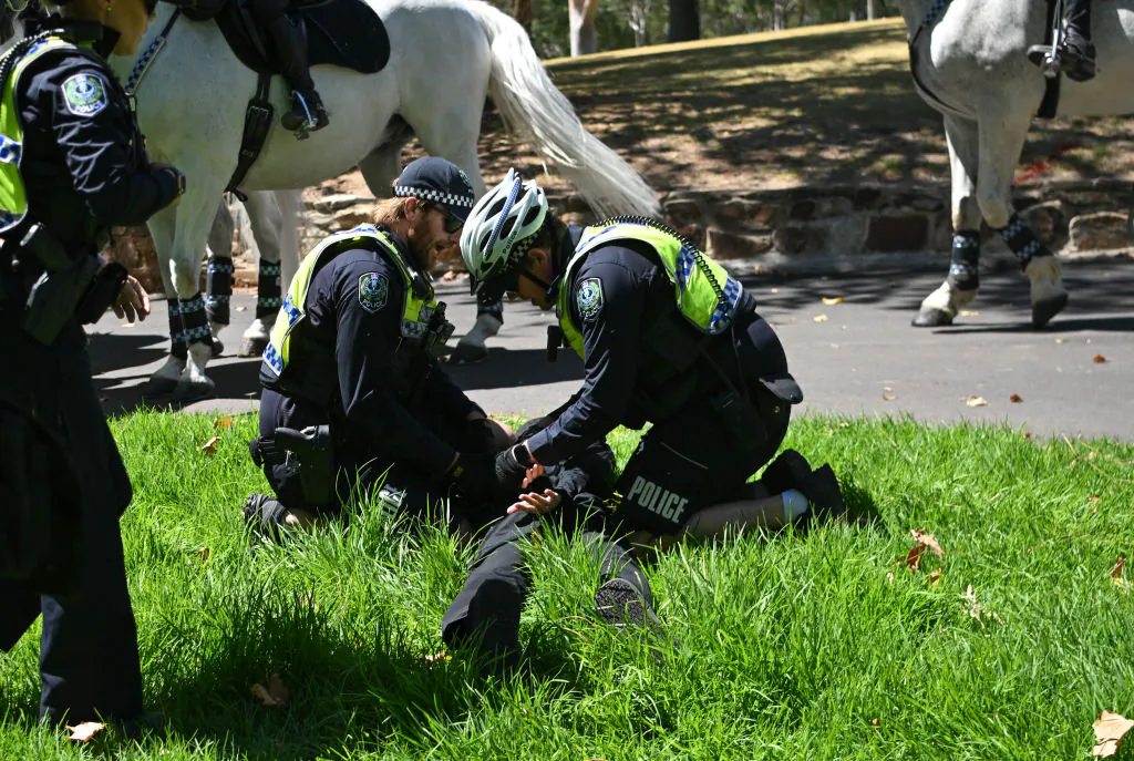 Members of the National Socialist Network (NSN) are arrested as they hold in the East2 Parklands a counter protest on North Terrace in Adelaide, Australia on Jan. 26, 2025. (Tracey Nearmy/Getty Images)