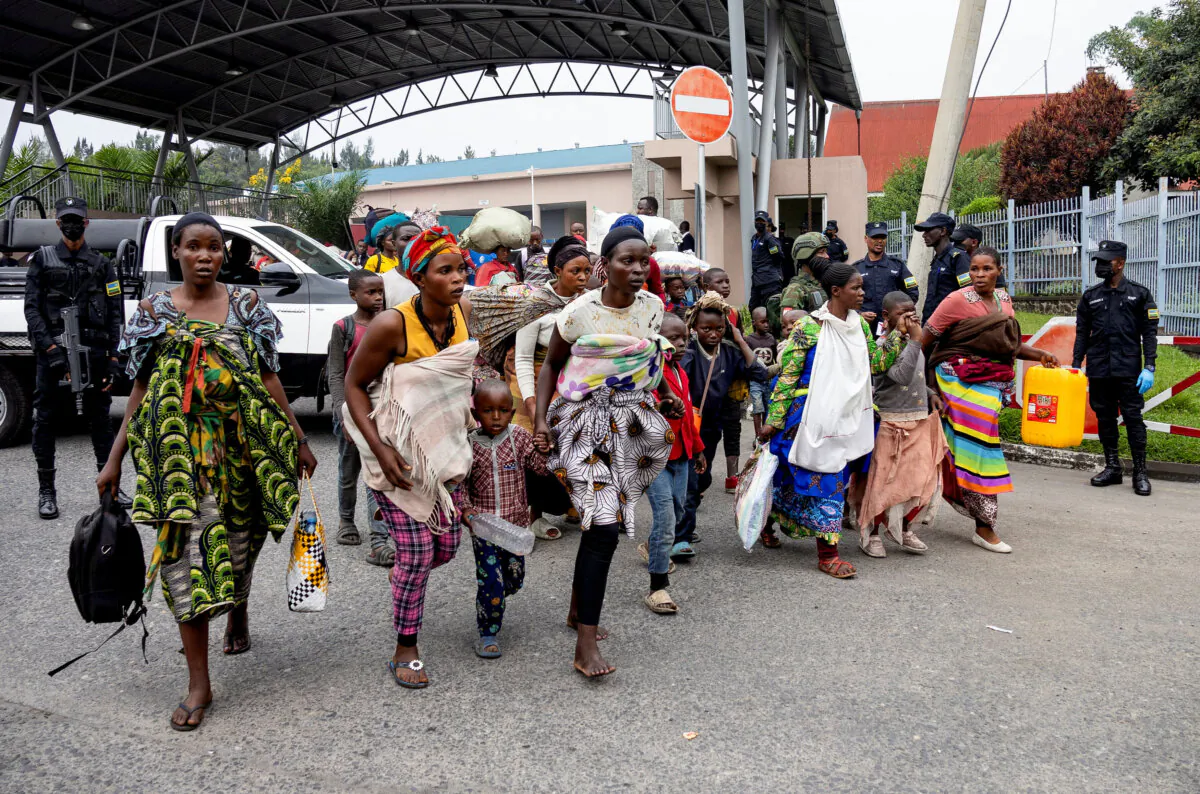 Humanitarian staff and their families flee from Goma, eastern Democratic Republic of Congo, following fighting between M23 rebels and the Armed Forces of the Democratic Republic of Congo, in Gisenyi, Rwanda, on Jan. 27, 2025. (Reuters/Jean Bizimana)