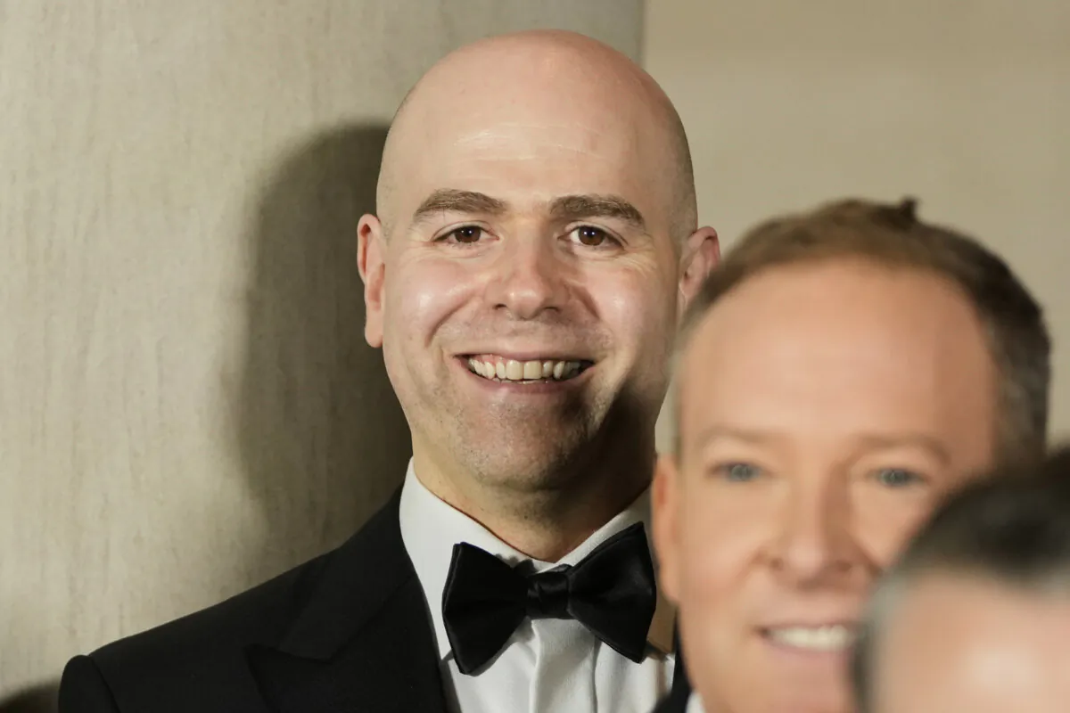 Stephen Miran, U.S. President Donald Trump's pick to lead the Council of Economic Advisers, poses for a photo with other nominees and appointments at the National Gallery of Art in Washington on Jan. 18, 2025. (AP Photo/Mark Schiefelbein)