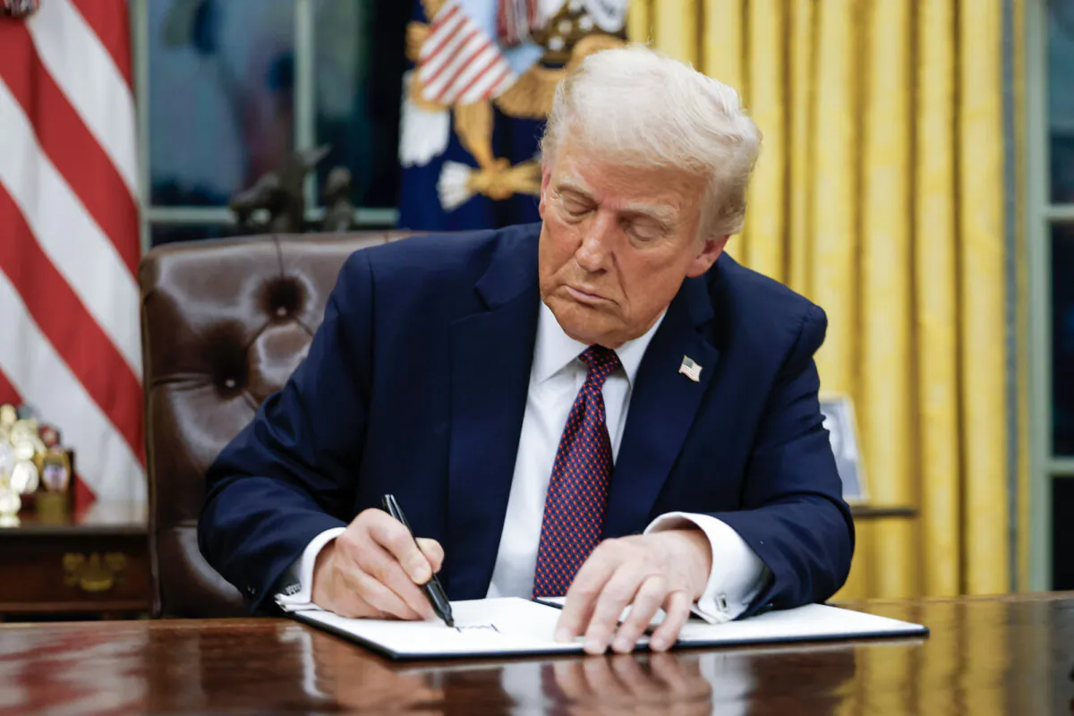 President Donald Trump signs executive orders in the Oval Office of the White House on Jan. 20, 2025. (Anna Moneymaker/Getty Images)