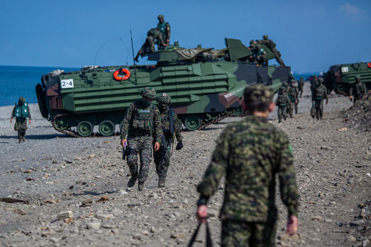 Soldiers prepare amphibious assault vehicles after an amphibious landing drill during the Han Kuang military exercise, which simulates China's People's Liberation Army invading the island, in Pingtung, Taiwan, on July 28, 2022. (Annabelle Chih/Getty Images)