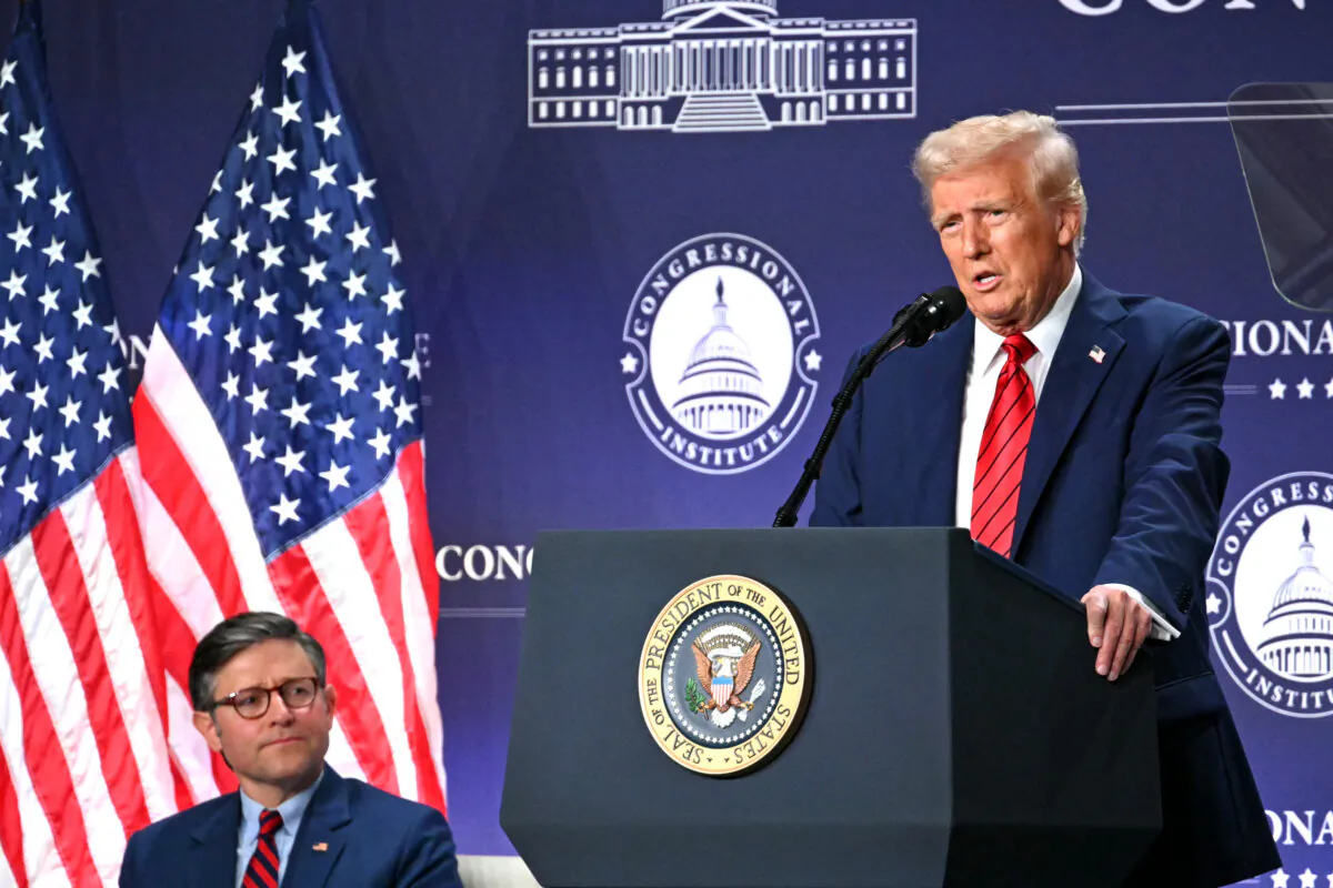 US President Donald Trump delivers remarks alongside Speaker of the House Mike Johnson (L) at the House Republican Members Conference Dinner at Trump National Doral Miami, in Miami, Florida on Jan. 27, 2025. (Photo by Mandel NGAN / AFP)
