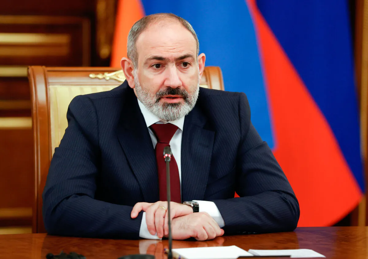 Armenian Prime Minister Nikol Pashinyan speaks to Russian Prime Minister Mikhail Mishustin during their talks in Moscow on April 20, 2022. (Dmitry Astakhov, Sputnik via AP)