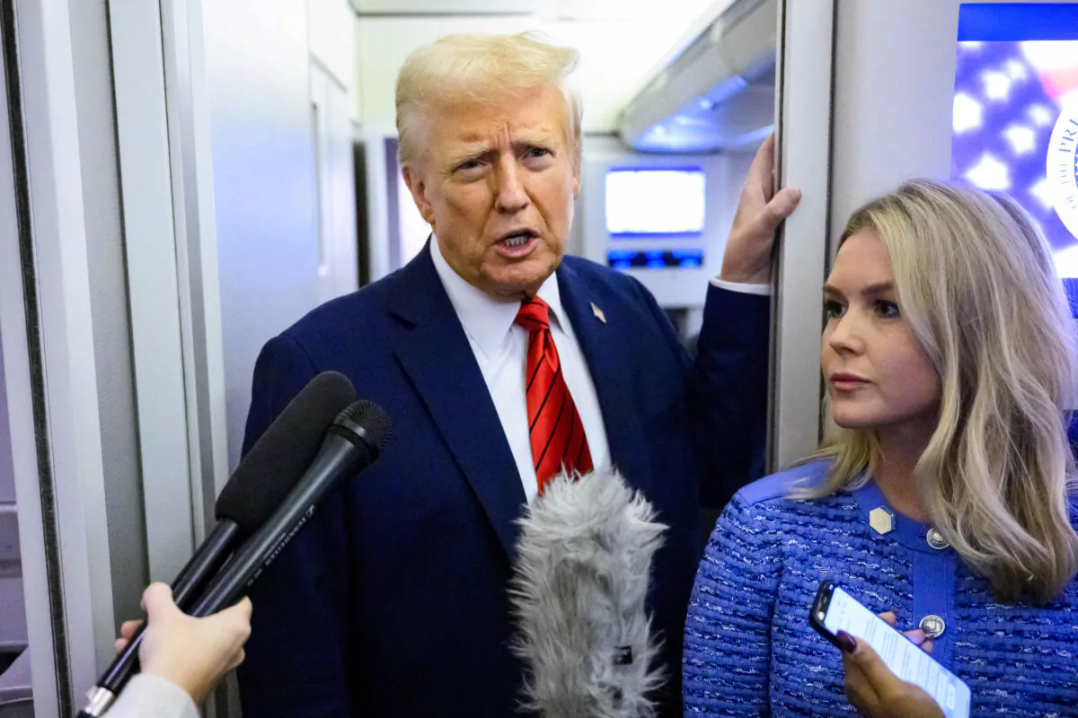 President Donald Trump, alongside White House press secretary Karoline Leavitt, speaks to reporters while in flight on Air Force One to Joint Base Andrews, on Jan. 27, 2025. (Mandel Ngan/AFP via Getty Images)