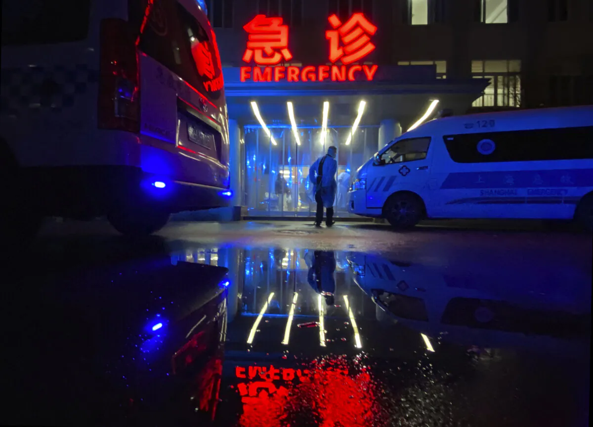 An ambulance driver walks into the busy emergency area of a hospital in Shanghai, China, on Jan. 13, 2023. (Kevin Frayer/Getty Images)