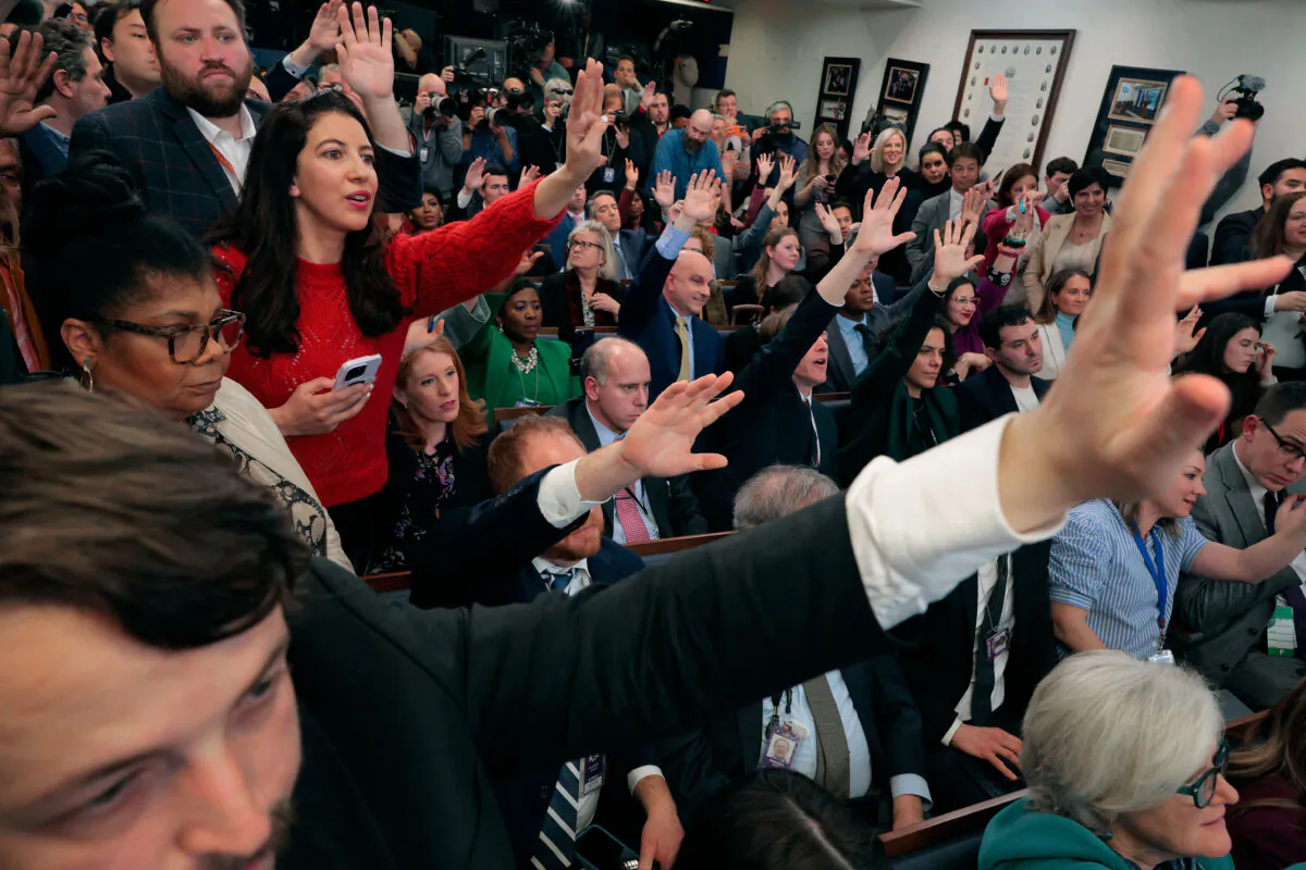 Reporters try to ask one last question before White House press secretary Karoline Leavitt ends her first news conference in the White House briefing room on Jan. 28. (Chip Somodevilla/Getty Images)
