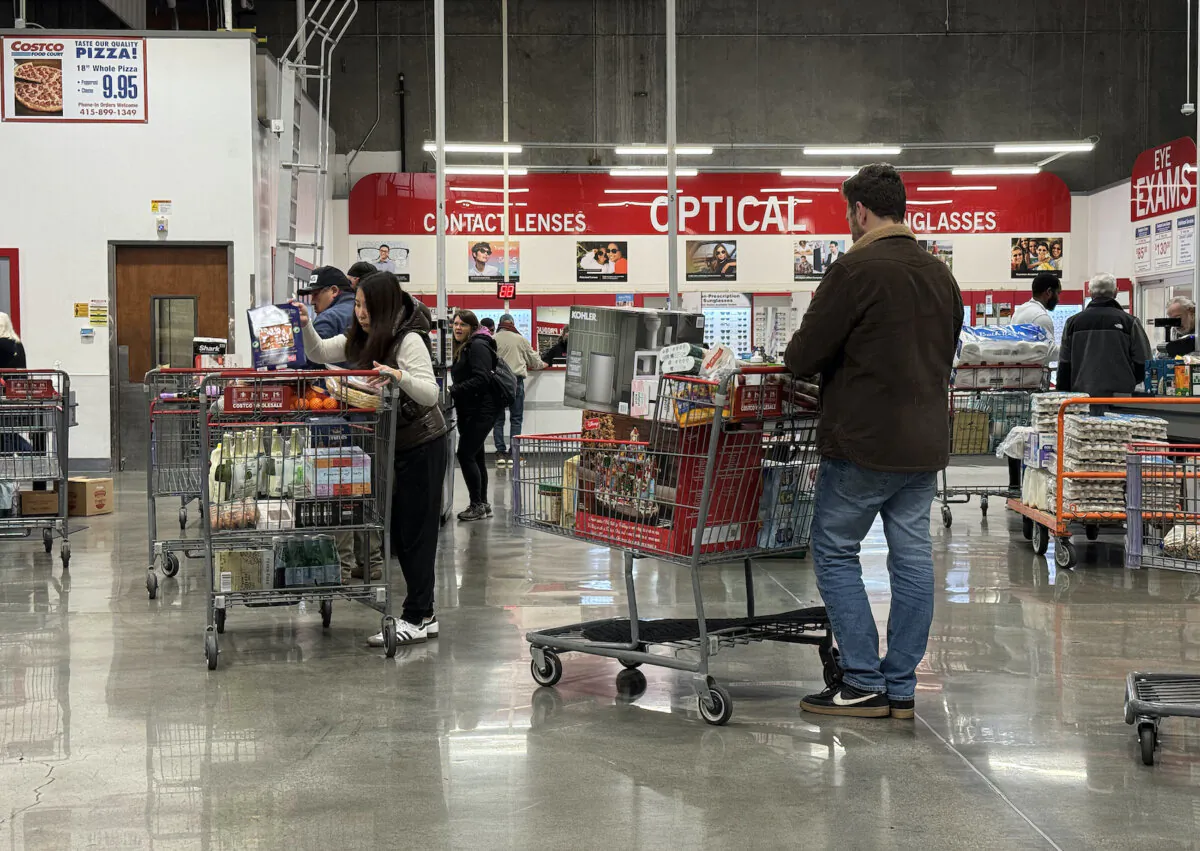 Customers wait in line to check out at a Costco store in Novato, Calif., on Dec. 11, 2024. (Justin Sullivan/Getty Images)