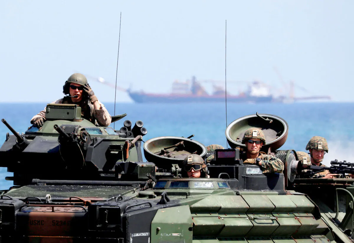 U.S. Marines arrive in an amphibious assault vehicle during the amphibious landing exercises of the U.S.–Philippines war games at a military camp in Zambales Province, Philippines, on April 11, 2019. (Reuters/Eloisa Lopez)