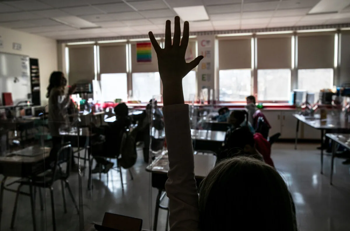 Third grade literacy instructor Katelyn Battinelli speaks with students at Stark Elementary School in Stamford, Conn., on March 10, 2021. (John Moore/Getty Images)