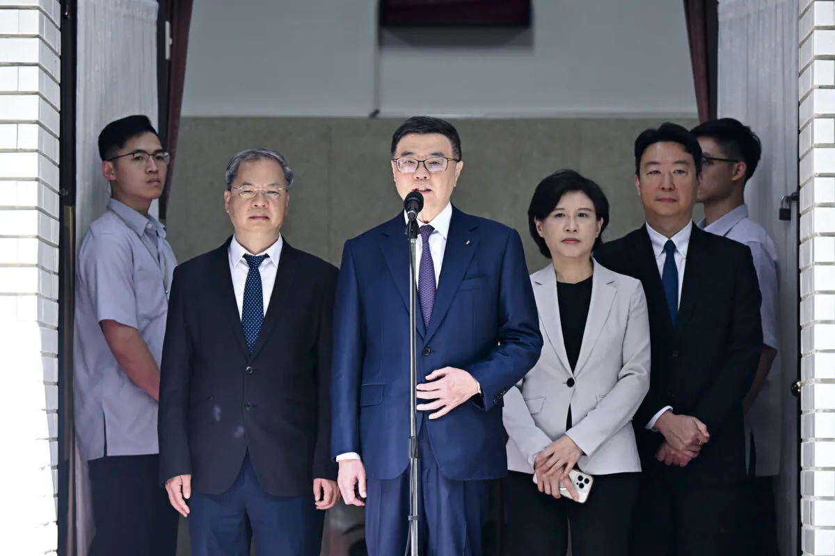 Taiwanese Premier Cho Jung-tai (C) in front of the Legislative Yuan in Taipei, Taiwan, on June 11, 2024. (Sung Pi-Lung/The Epoch Times)