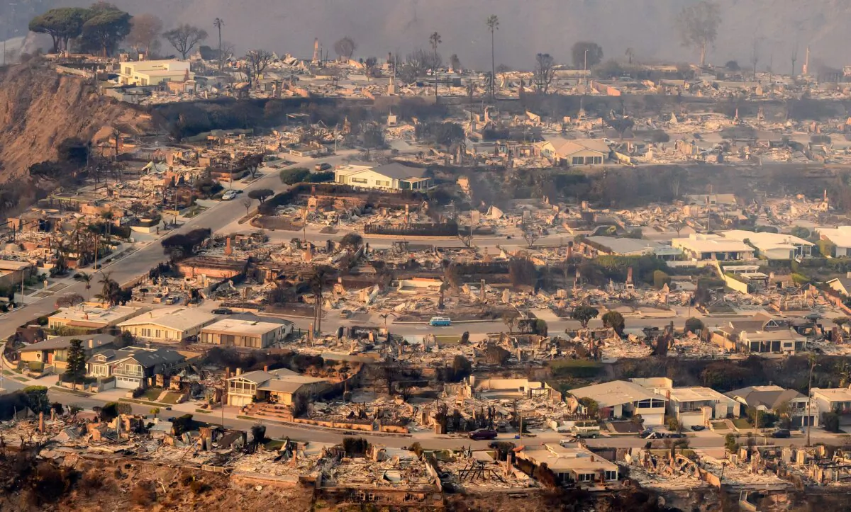 In this aerial view taken from a helicopter, burned homes are seen from above during the Palisades fire near the Pacific Palisades neighborhood of Los Angeles, California on Jan. 9, 2025. (JOSH EDELSON / AFP via Getty Images)