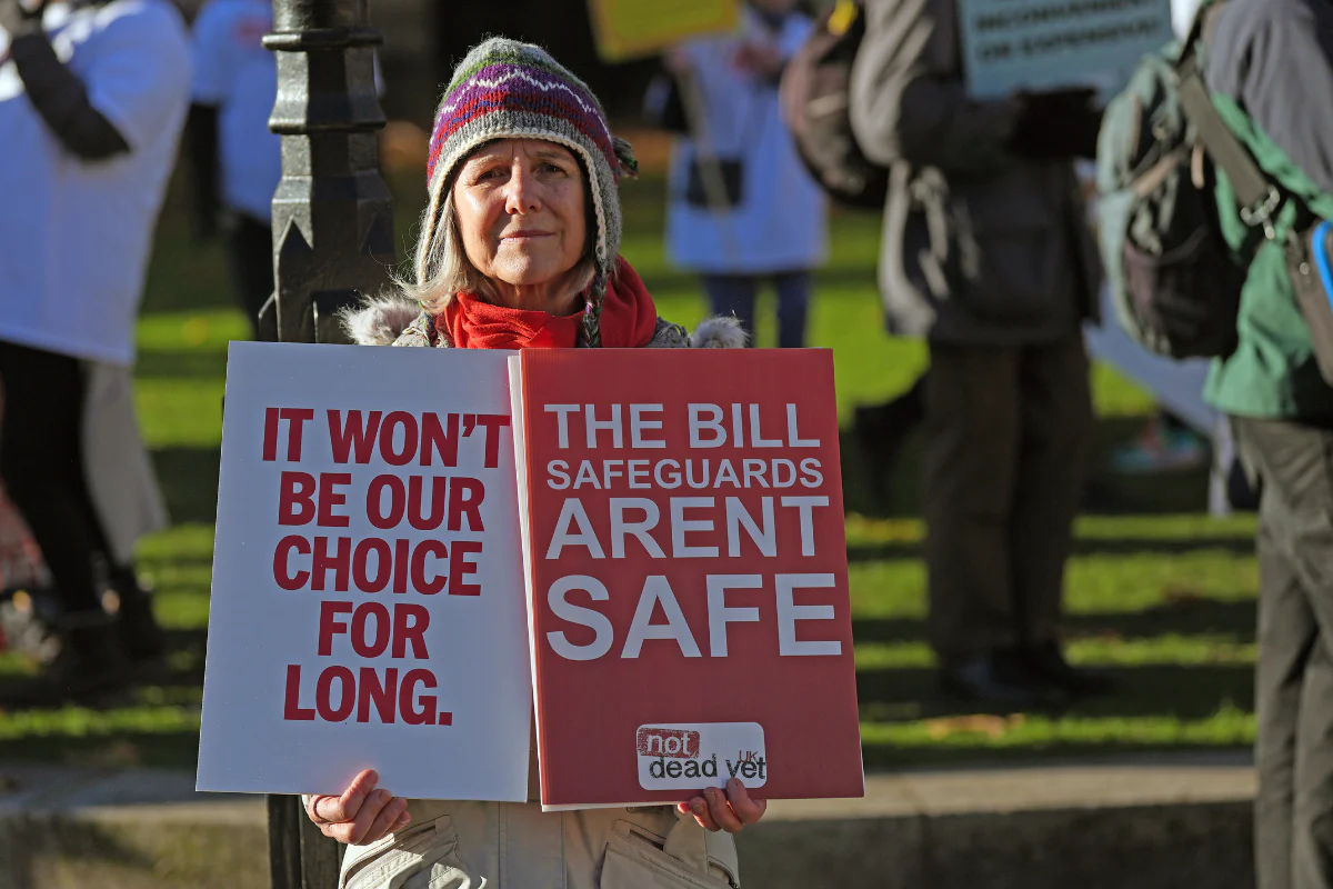 People take part in a demonstration at Old Palace Yard to oppose the Terminally Ill Adults (End of Life) Bill in Westminster, London, on Nov. 29, 2024. (Yui Mok/PA Wire)