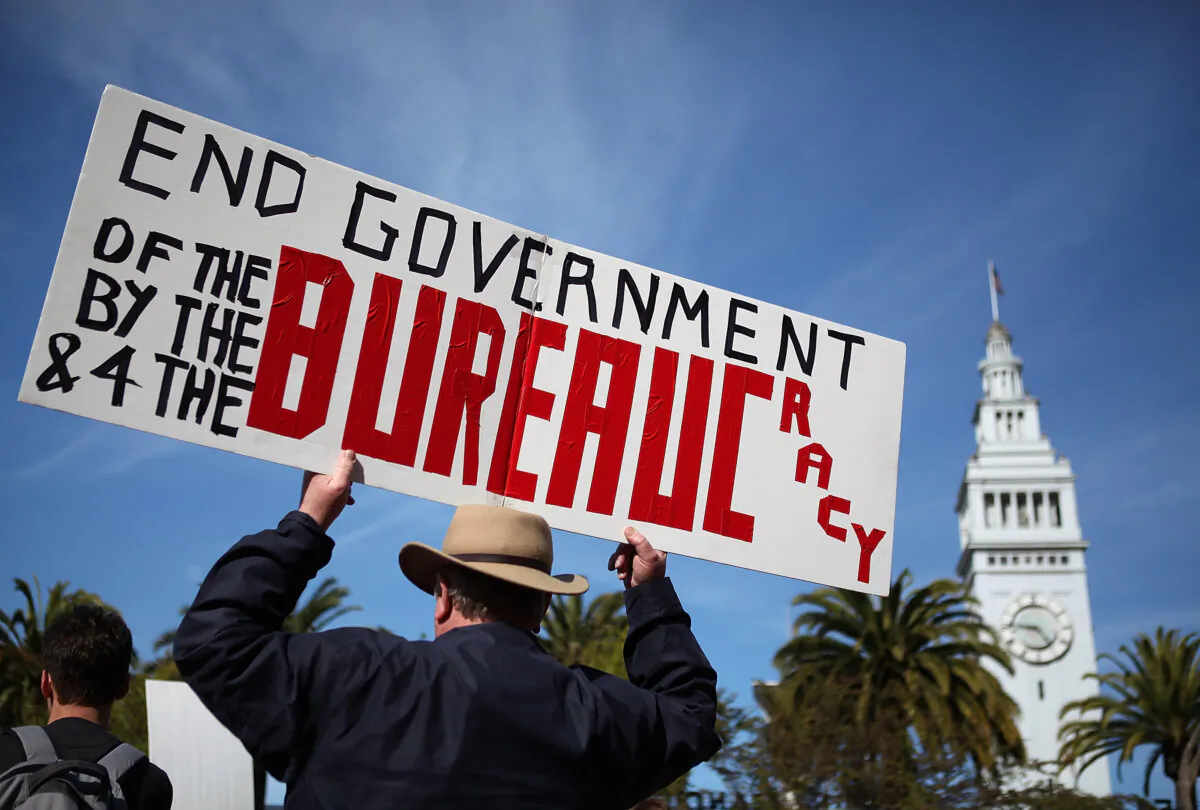 An activist holds a sign during a tax day Tea Party rally in San Francisco, Calif., on April 15, 2011. (Justin Sullivan/Getty Images)