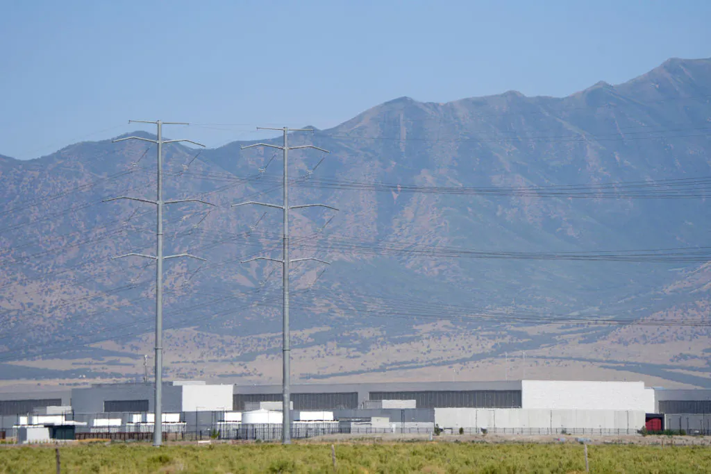 Large electrical transmission lines are routed to Meta’s newly completed Facebook data center in Eagle Mountain, Utah, on July 18, 2024. (George Frey/AFP via Getty Images)