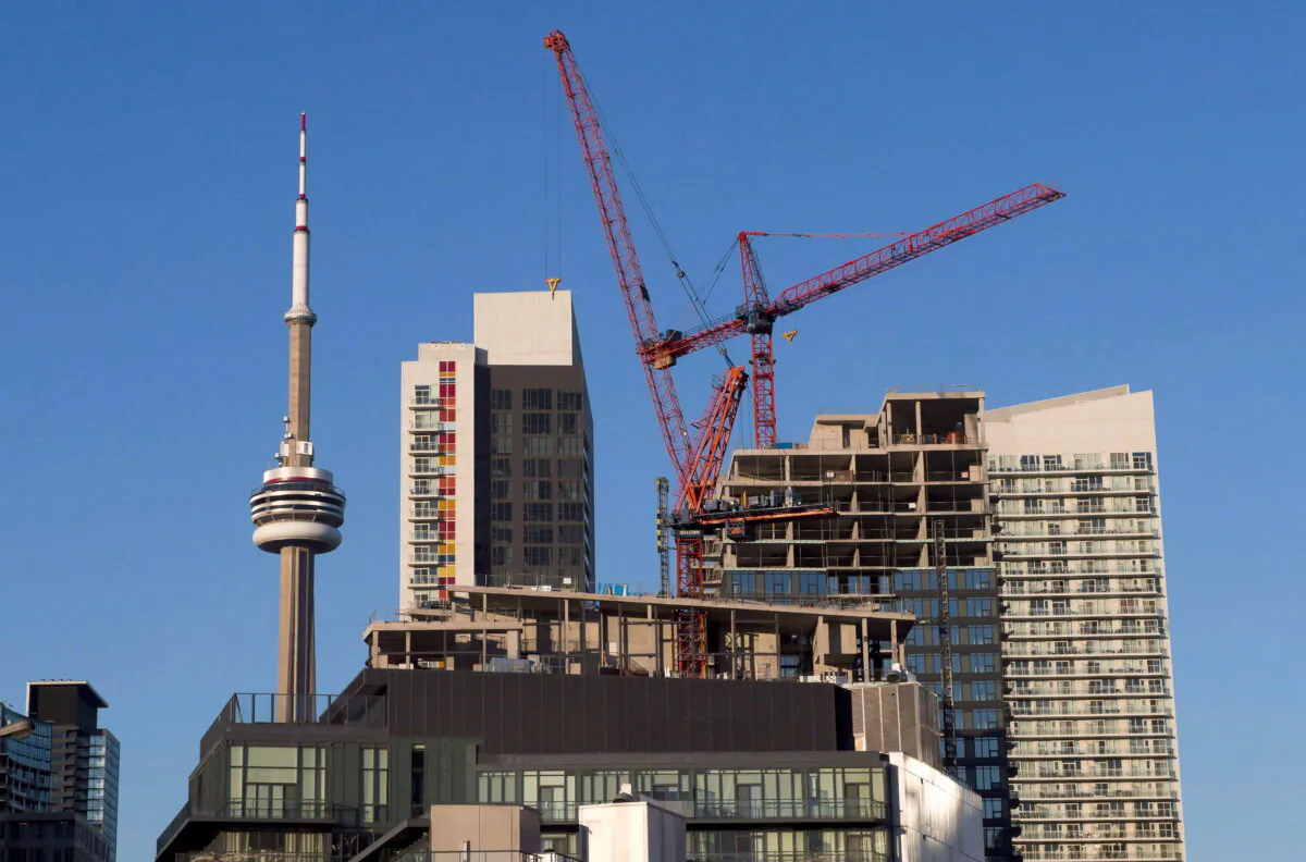 Construction cranes are seen in Toronto on July 5, 2017. (The Canadian Press/Frank Gunn) 