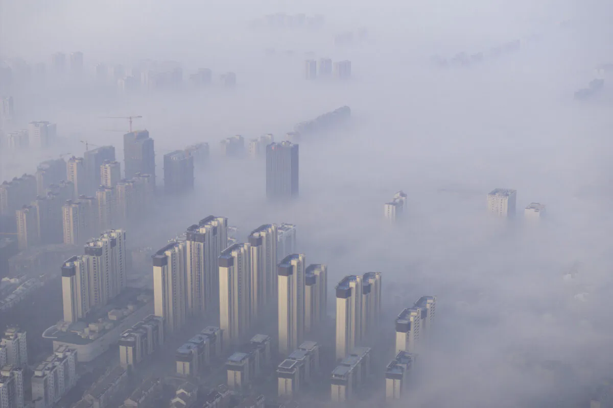 Buildings shrouded in fog and air pollution in Huai’an, in China's eastern Jiangsu Province, on Dec. 28, 2023. (STR/AFP via Getty Images)