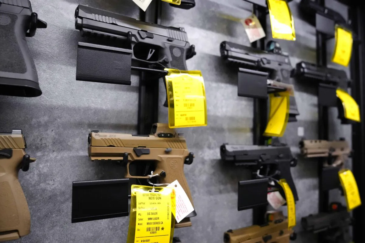 A selection of pistols at a gun shop in Kittery, Maine, on Aug. 9. (Charles Krupa/AP Photo)