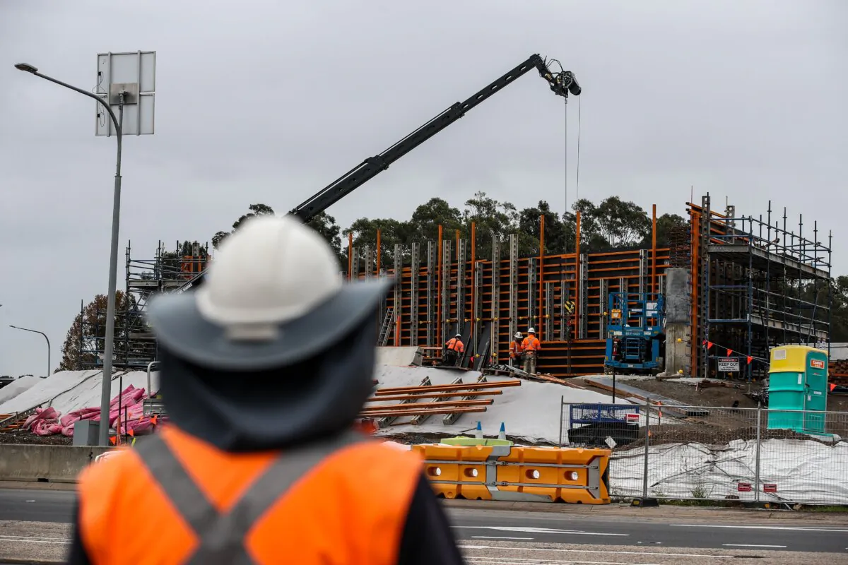 Workers are seen at a construction project in Newcastle, Australia, on May 13, 2024. (Roni Bintang/Getty Images)