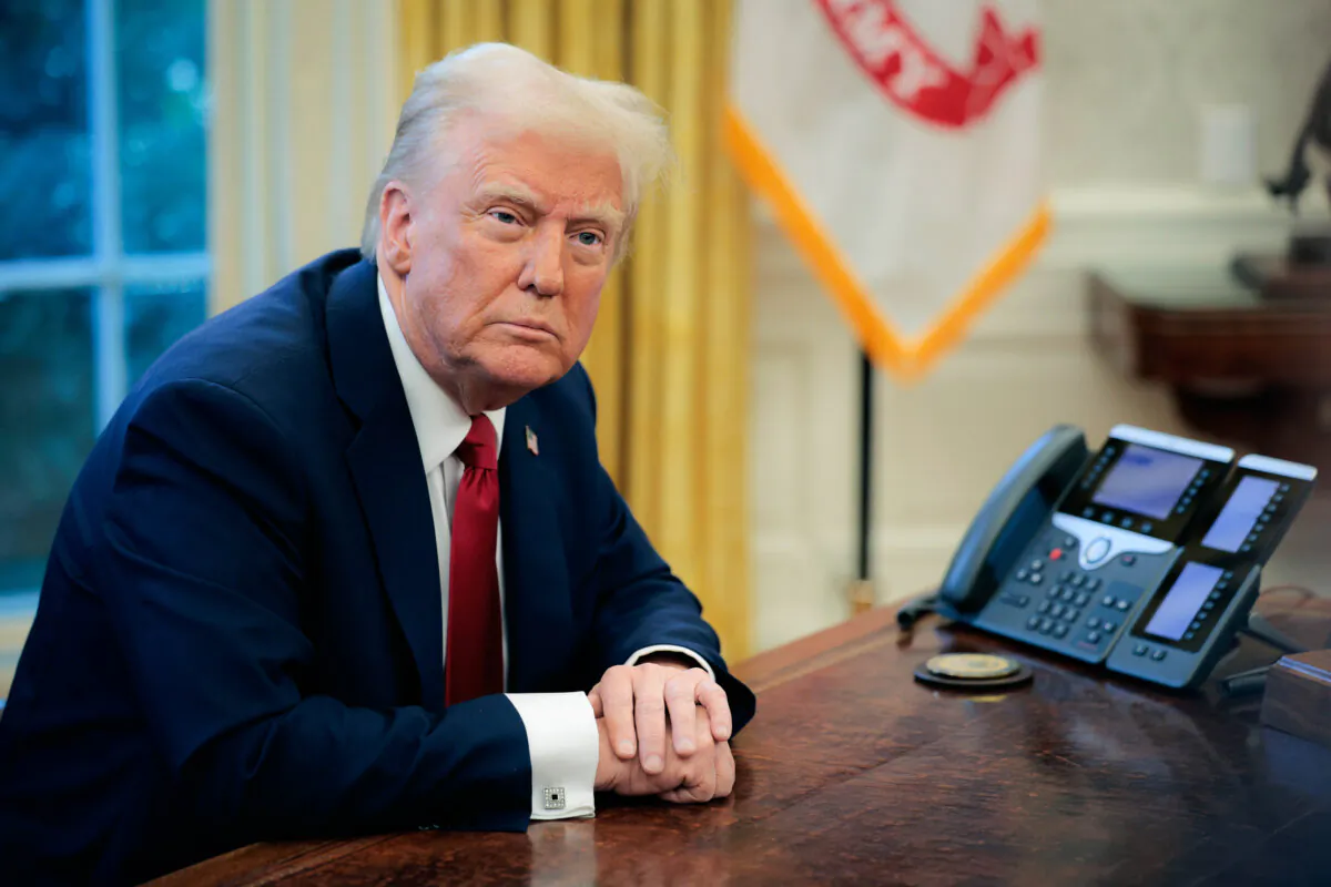 U.S. President Donald Trump talks to reporters from the Resolute Desk at the White House in Washington on Jan. 30, 2025. (Chip Somodevilla/Getty Images)