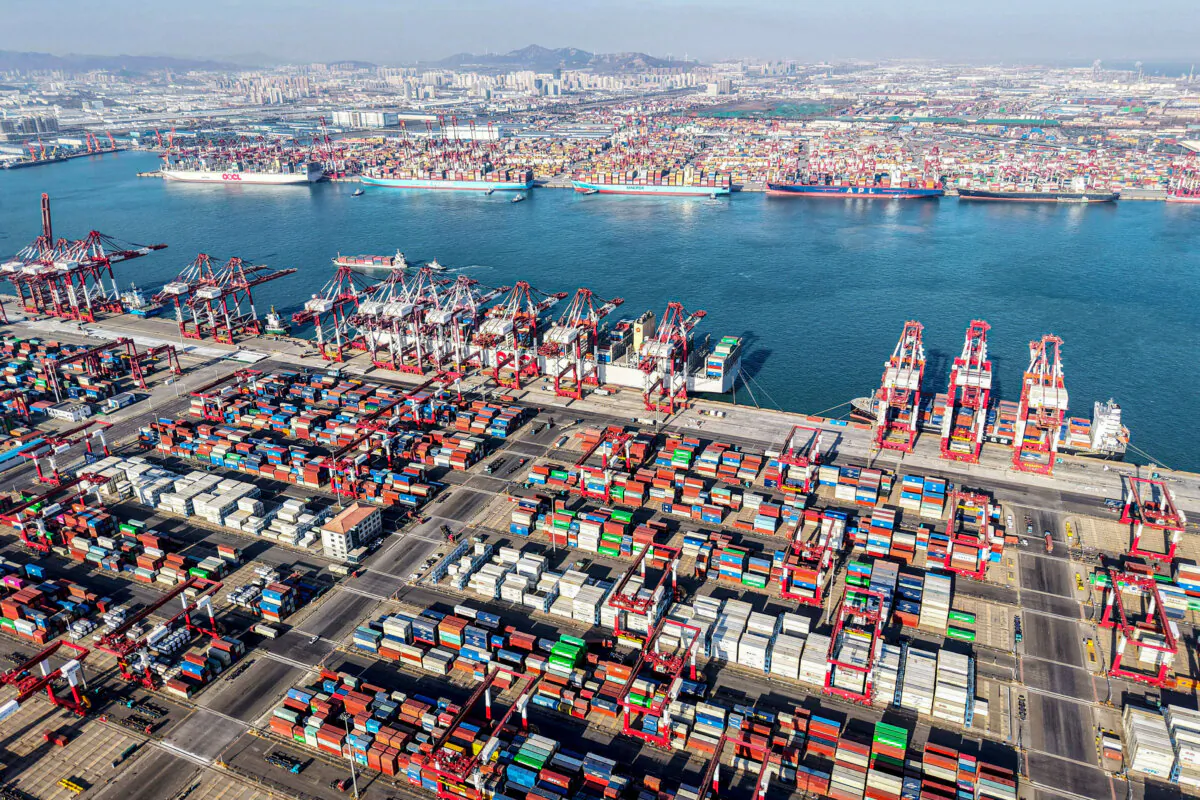 Shipping containers and gantry cranes are seen at Qingdao port in Qingdao, in eastern China's Shandong Province, on Dec. 26, 2024. (STR/AFP via Getty Images)