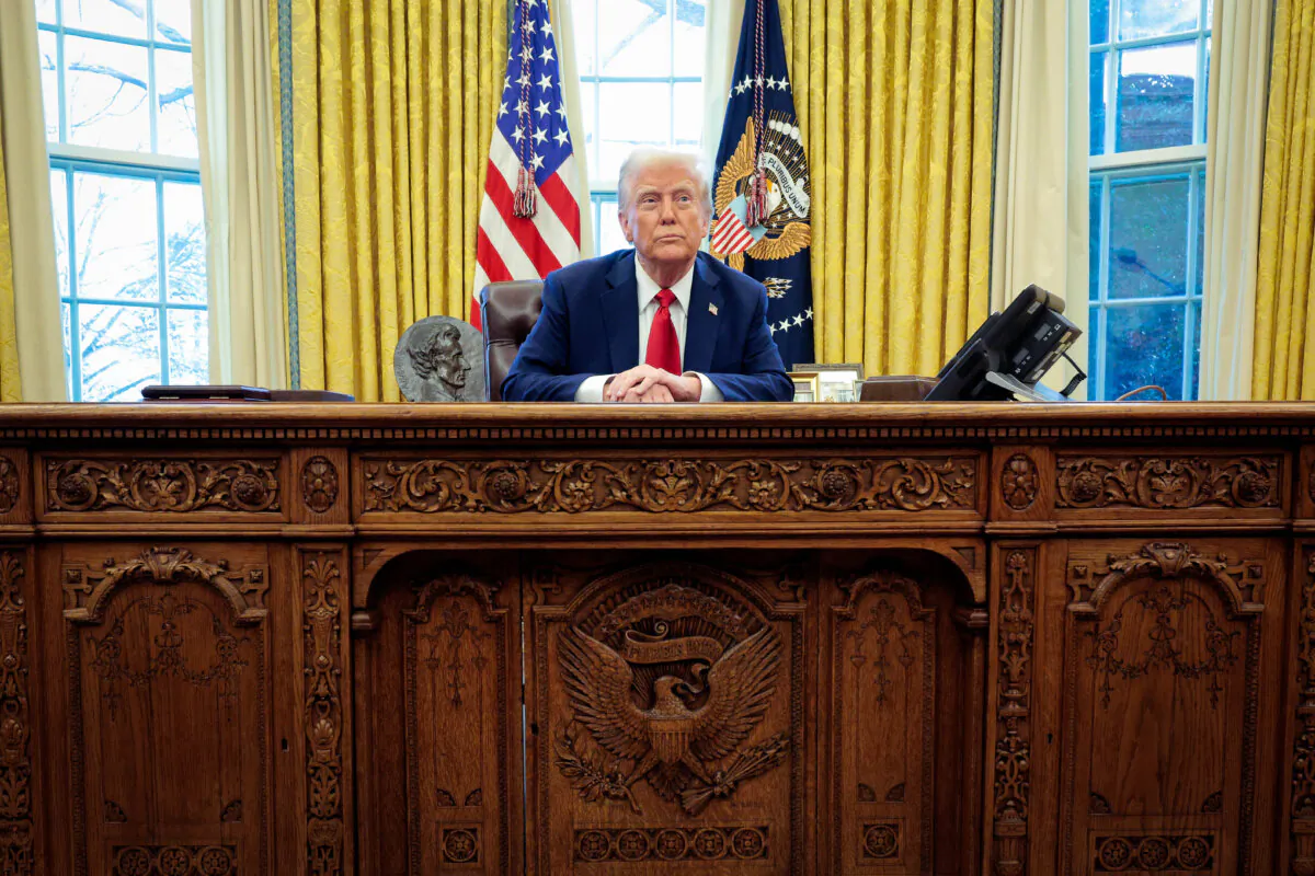 President Donald Trump talks to reporters from the Resolute Desk in the Oval Office at the White House in Washington, DC, on Jan. 30, 2025. (Chip Somodevilla/Getty Images)