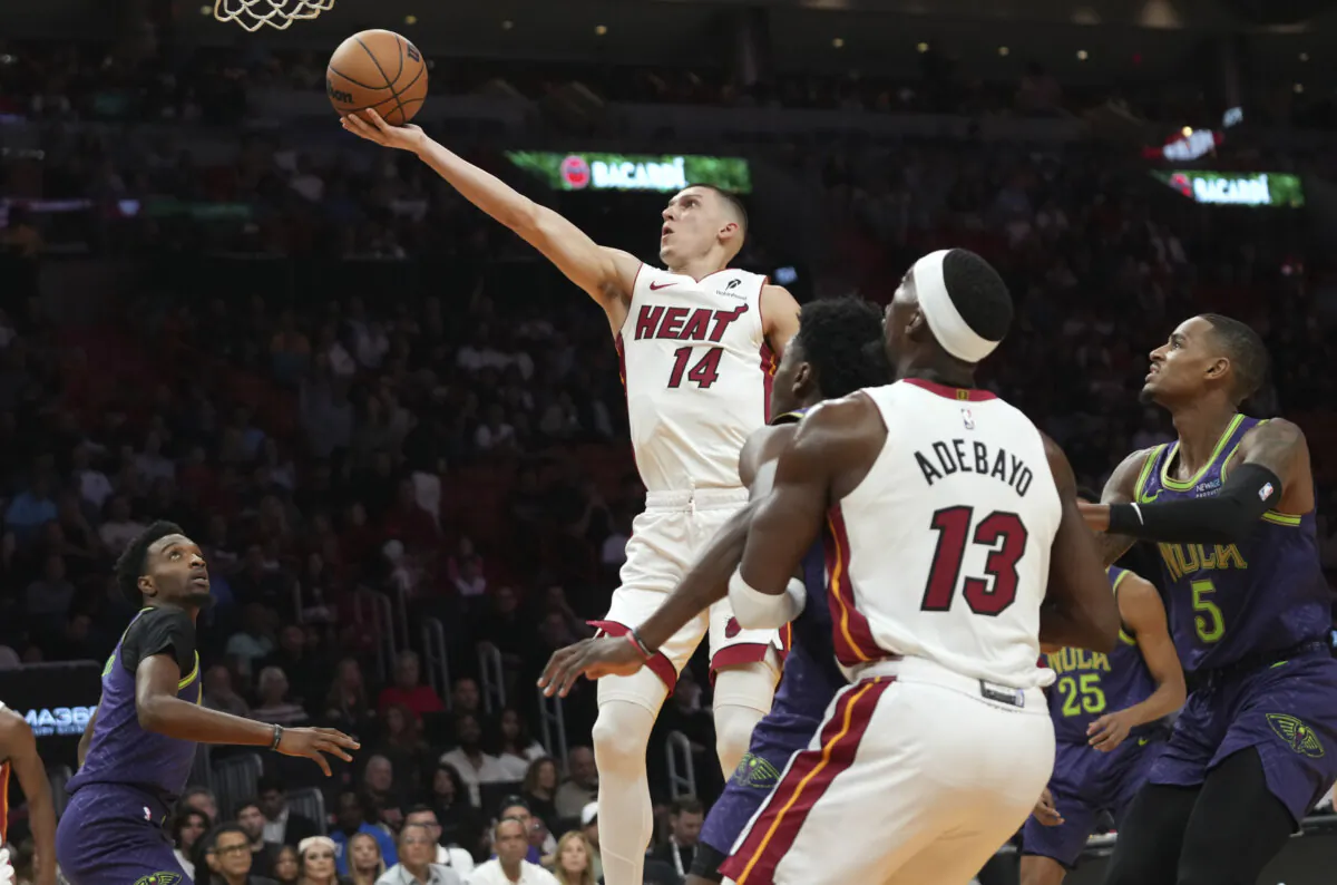 Miami Heat guard Tyler Herro (14) goes to the basket during the first half of an NBA basketball game against the New Orleans Pelicans in Miami, on Jan. 1, 2025. (Lynne Sladky /AP Photo)