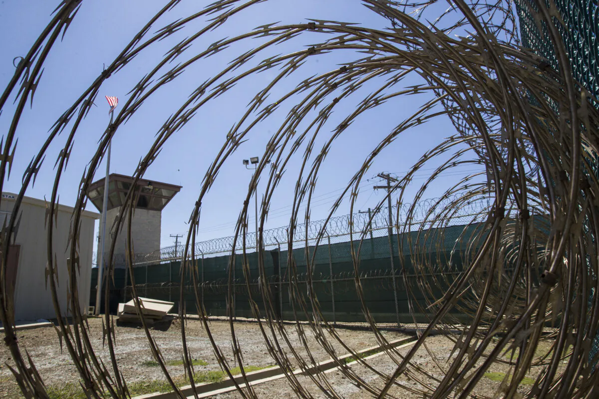 The control tower is seen through the razor wire inside the Camp VI detention facility in Guantanamo Bay Naval Base, Cuba, on April 17, 2019. (Alex Brandon/AP Photo)
