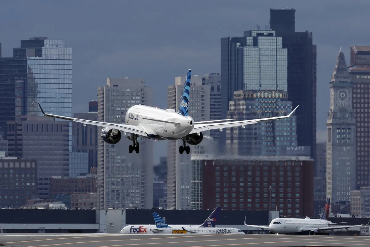 A JetBlue plane lands at Logan International Airport in Boston on Jan. 26, 2023. (Michael Dwyer/AP Photo)