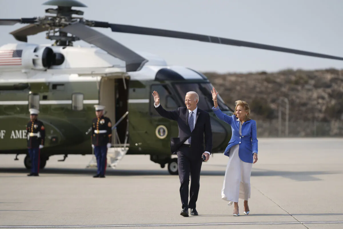 President Joe Biden and First Lady Jill Biden wave as they walk to board Air Force One at Los Angeles International Airport on Jan. 8, 2025. (Stephanie Scarbrough/AP Photo)